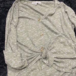 It’s a green button up long sleeve sweater/shirt